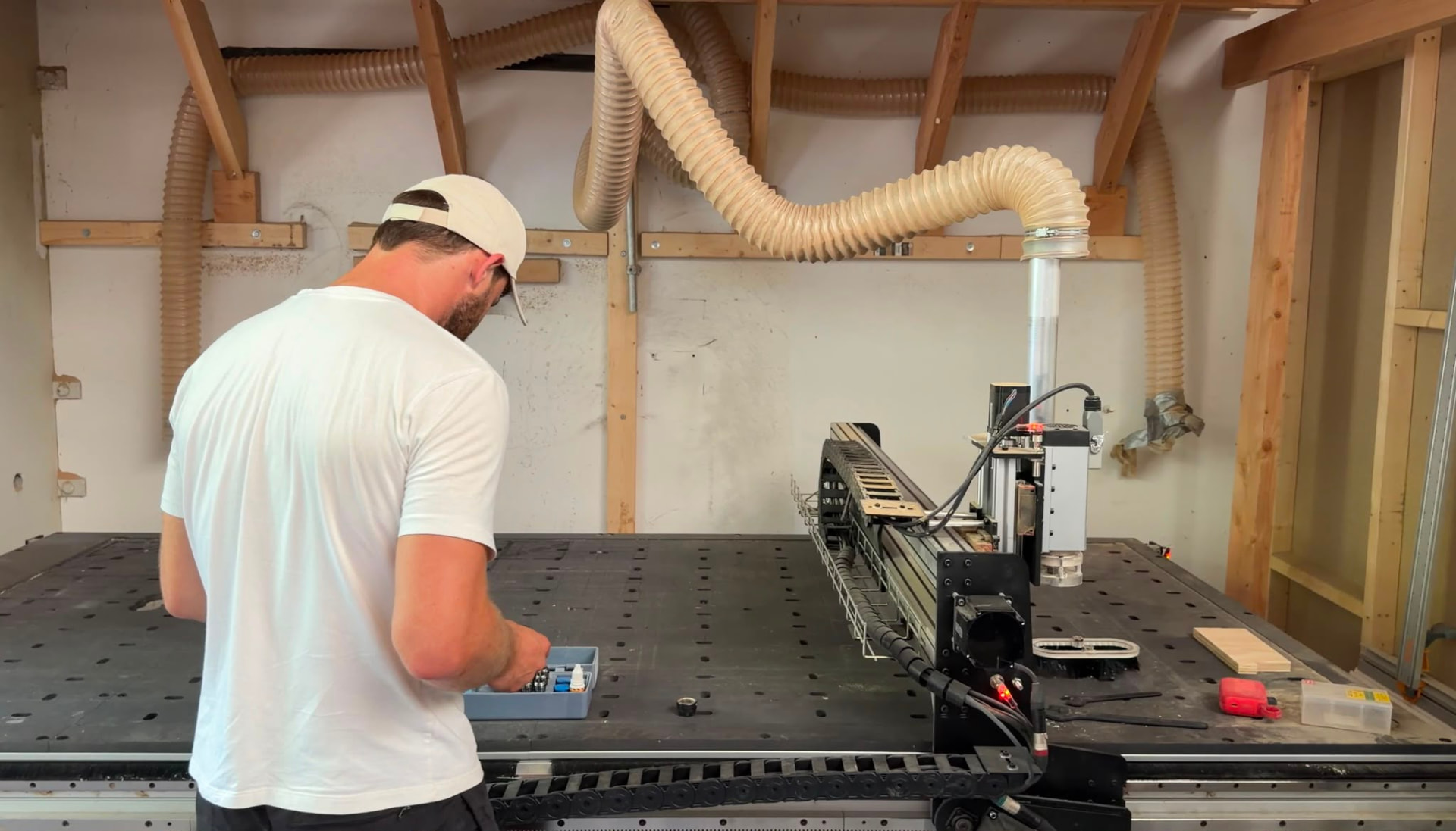 Normunds preparing tooling at the CNC table in the Skyline Kasten workshop